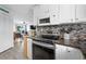 Open kitchen showcasing stainless steel appliances and convenient access to the living area at 1217 S Ocean Blvd. # 5, Surfside Beach, SC 29575