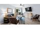 Well-lit living room with comfortable seating and a view of the balcony at 1217 S Ocean Blvd. # 5, Surfside Beach, SC 29575