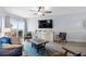 Bright living room with ocean view with comfortable seating and dining area at 1217 S Ocean Blvd. # 5, Surfside Beach, SC 29575