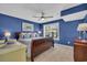 Bedroom with blue walls, ceiling fan, and natural light through the window at 124 Turtle Creek Dr., Pawleys Island, SC 29585