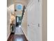 Bright entryway with hardwood floors, elegant lighting, and a view of the front door at 124 Turtle Creek Dr., Pawleys Island, SC 29585