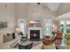 Comfortable living room with a fireplace, a TV, and lots of natural light at 124 Turtle Creek Dr., Pawleys Island, SC 29585