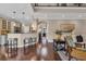 Bright open-concept living area with hardwood floors and a view of the kitchen at 124 Turtle Creek Dr., Pawleys Island, SC 29585