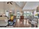 Spacious living room with high ceilings and a harmonious flow to the kitchen and dining areas at 124 Turtle Creek Dr., Pawleys Island, SC 29585