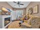 Comfortable living room with a fireplace, plush seating, and a bright window at 124 Turtle Creek Dr., Pawleys Island, SC 29585