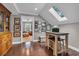 Bright office space featuring a skylight, wood floors, and a built-in desk, perfect for a home office at 124 Turtle Creek Dr., Pawleys Island, SC 29585