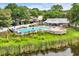 Community pool area offering a refreshing escape with ample seating and a relaxing atmosphere for residents at 124 Turtle Creek Dr., Pawleys Island, SC 29585
