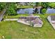 An aerial view of a well maintained home next to a small pond at 131 Pine Lake Circle, Ocean Isle Beach, NC 28469