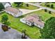 Aerial view of a fenced backyard, pond, detached garage, and a well-maintained property at 131 Pine Lake Circle, Ocean Isle Beach, NC 28469