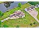 An aerial view showcasing this beautiful home, detached garage, and well manicured lot at 131 Pine Lake Circle, Ocean Isle Beach, NC 28469