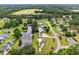An aerial view of homes on a creek with mature trees at 131 Pine Lake Circle, Ocean Isle Beach, NC 28469