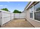 Private backyard featuring a concrete patio area and privacy fence at 131 Pine Lake Circle, Ocean Isle Beach, NC 28469