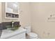 Chic bathroom features a glass bowl sink and modern fixtures, plus a decorative mirror at 131 Pine Lake Circle, Ocean Isle Beach, NC 28469
