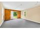Bright and spacious garage with wood paneling and sliding glass door to outside at 131 Pine Lake Circle, Ocean Isle Beach, NC 28469