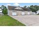 Spacious detached garage with multiple bays and ample parking on a concrete driveway at 131 Pine Lake Circle, Ocean Isle Beach, NC 28469