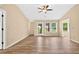 Well-lit living room with modern flooring, neutral paint, and an open layout with ample natural light at 131 Pine Lake Circle, Ocean Isle Beach, NC 28469