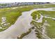 Scenic aerial view of the property featuring a marsh, waterway, and private dock at 140 South Cove Pl. # 6C, Pawleys Island, SC 29585