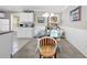 Bright dining area with open access to the kitchen and views of lush landscaping at 140 South Cove Pl. # 6C, Pawleys Island, SC 29585