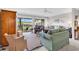 Comfortable living room with sliding glass doors opening to a screened porch and exterior views at 140 South Cove Pl. # 6C, Pawleys Island, SC 29585