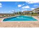 Community pool offers a serene spot for relaxation, complete with lounge chairs and a manicured lawn at 140 South Cove Pl. # 6C, Pawleys Island, SC 29585