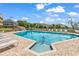 Inviting community pool is surrounded by brick pavers and comfortable lounge chairs, perfect for summertime enjoyment at 140 South Cove Pl. # 6C, Pawleys Island, SC 29585