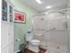 Bright bathroom with a glass-enclosed shower, toilet, and storage cabinet, designed for convenience at 1401 Lighthouse Dr. # 4334, Little River, SC 29566