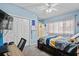 Well-lit bedroom featuring carpet flooring, ceiling fan, double closet, and a study desk area at 1401 Lighthouse Dr. # 4334, Little River, SC 29566