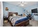 Comfortable bedroom with a wooden bed frame, desk, and a ceiling fan, creating a cozy retreat at 1401 Lighthouse Dr. # 4334, Little River, SC 29566