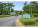 Well-maintained community entrance featuring manicured landscaping and clear signage for guests and residents at 1401 Lighthouse Dr. # 4334, Little River, SC 29566