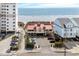 Coastal-style home with a red roof offering ocean views, surrounded by convenient parking at 1401 Lighthouse Dr. # 4334, Little River, SC 29566