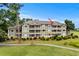 Charming condo building with screened in porches overlooking manicured lawn and a golf course at 1401 Lighthouse Dr. # 4334, Little River, SC 29566