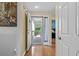 View of the hallway through a screen door to the porch with hardwood floors at 1401 Lighthouse Dr. # 4334, Little River, SC 29566