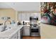 Well-equipped kitchen with stainless steel appliances and sleek countertops, perfect for culinary enthusiasts at 1401 Lighthouse Dr. # 4334, Little River, SC 29566