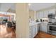 Open kitchen design with stainless appliances, white cabinetry, and easy access to the dining and living areas at 1401 Lighthouse Dr. # 4334, Little River, SC 29566