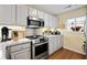 Bright kitchen featuring stainless steel appliances, ample counter space, and natural light from the window at 1401 Lighthouse Dr. # 4334, Little River, SC 29566