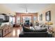 Bright living room features large windows, hardwood floors, comfortable seating, and contemporary decor at 1401 Lighthouse Dr. # 4334, Little River, SC 29566
