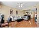 Spacious living room with hardwood floors, comfortable seating, and a seamless flow to the dining area at 1401 Lighthouse Dr. # 4334, Little River, SC 29566