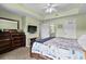 Spacious main bedroom with dresser, mounted TV, and ample closet space, offering comfortable living at 1401 Lighthouse Dr. # 4334, Little River, SC 29566