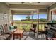 Relaxing screened porch featuring comfortable seating, a ceiling fan, and scenic golf course views at 1401 Lighthouse Dr. # 4334, Little River, SC 29566