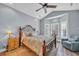 Comfortable bedroom with a large bed, vaulted ceiling, and bay window with plantation shutters at 1413 Cottage Cove Circle, North Myrtle Beach, SC 29582