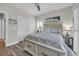 Bedroom with wood-look floors, bedside table, and bed with drawers beneath, creating ample storage at 1413 Cottage Cove Circle, North Myrtle Beach, SC 29582