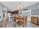 Bright dining area featuring a wooden table, counter seating, and hardwood floors at 1413 Cottage Cove Circle, North Myrtle Beach, SC 29582