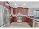 Well-appointed kitchen with stainless steel appliances, granite countertops, and ample cabinet space at 1413 Cottage Cove Circle, North Myrtle Beach, SC 29582