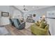 Spacious open concept living area featuring vaulted ceilings, hardwood floors, and stylish furnishings at 1413 Cottage Cove Circle, North Myrtle Beach, SC 29582