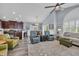 Open-concept living area with vaulted ceilings, hardwood floors, and flowing transition to the kitchen at 1413 Cottage Cove Circle, North Myrtle Beach, SC 29582
