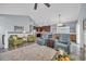 Inviting living area with vaulted ceilings, a ceiling fan, hardwood floors, and open to the kitchen at 1413 Cottage Cove Circle, North Myrtle Beach, SC 29582