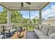 A screened-in porch offering neighborhood views and comfortable seating, creating a relaxing outdoor space at 1413 Cottage Cove Circle, North Myrtle Beach, SC 29582