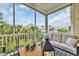 Inviting screened-in porch with a comfortable sofa and a table, perfect for outdoor living at 1413 Cottage Cove Circle, North Myrtle Beach, SC 29582
