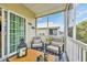 Relaxing screened porch with comfortable seating and a view of the neighborhood at 1413 Cottage Cove Circle, North Myrtle Beach, SC 29582