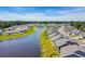 Stunning aerial view of the community with lake, landscaped common areas, and meticulously maintained properties at 1520 Jardine Loop, Little River, SC 29566
